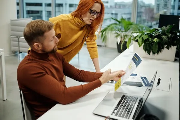 Comparing invoicing software for a small business on a laptop