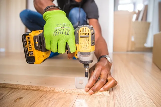 Construction and home improvement invoice templates: a worker using a power drill