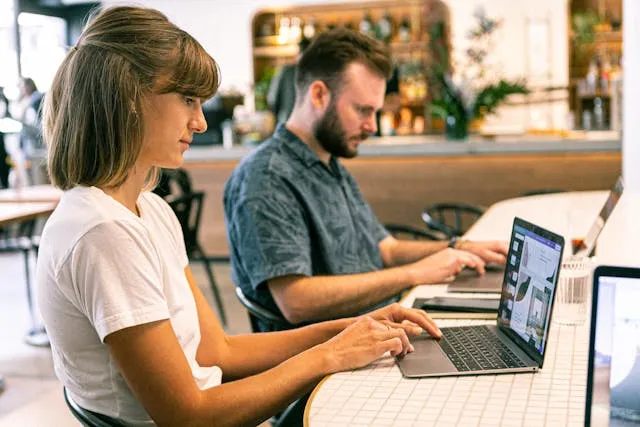 Financial and accounting invoice templates: two professionals working on laptops