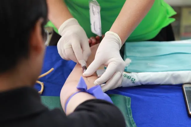 Medical and healthcare invoice templates: a nurse taking a blood sample