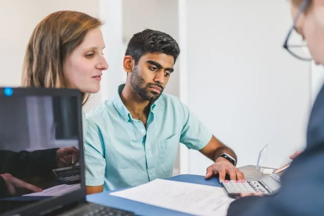 Professional services invoice templates: a consultant meeting a client at a desk