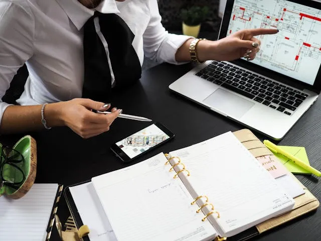 Real estate and property management invoice templates: an agent reviewing a floor plan