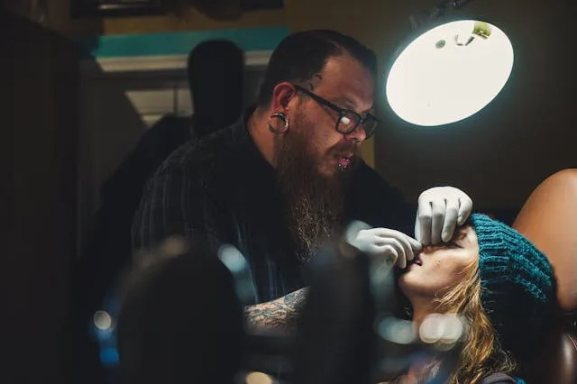 Specialized services invoice templates: a tattoo artist at work